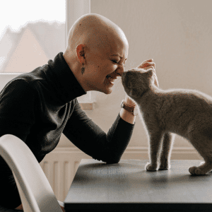 women with a cat in a cat cafe near Durham, NC