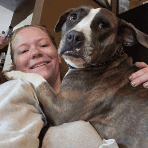 Bull City Pet Care Dog Walker with a dog - Our Durham Dog Walking Team