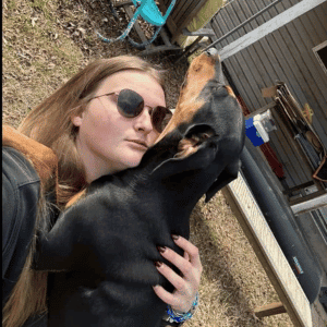 Bull City Pet Care Dog Walker with a dog 